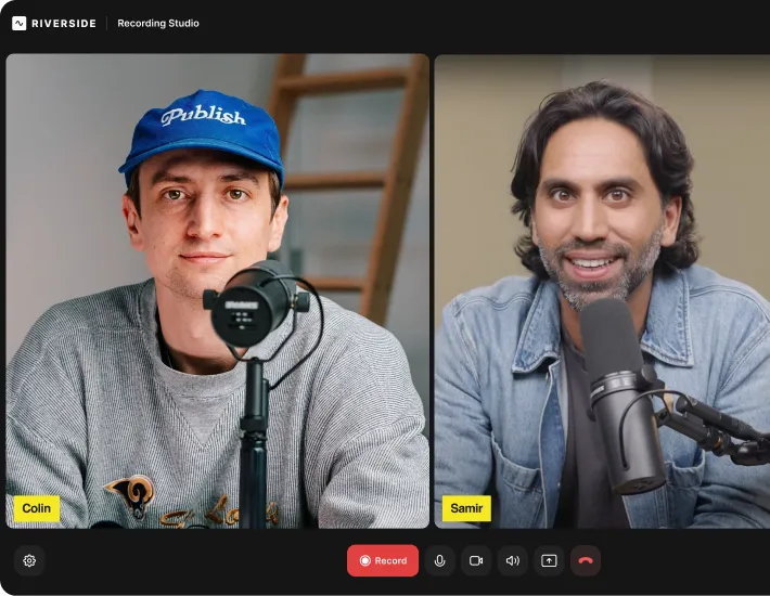 Video call interface showing two men, Colin wearing a blue 'Publish' cap and gray sweater, and Samir with dark hair in a denim jacket speaking into microphones.